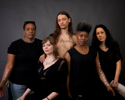 Family Portraits - a social justice portrait project. strangers  pose in traditional family style portraits to convey unity and hope. they write on their skin one word that represents how they would feel in a world that was free from discrimination