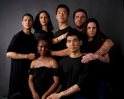 Family Portraits - a social justice portrait project. strangers  pose in traditional family style portraits to convey unity and hope. they write on their skin one word that represents how they would feel in a world that was free from discrimination